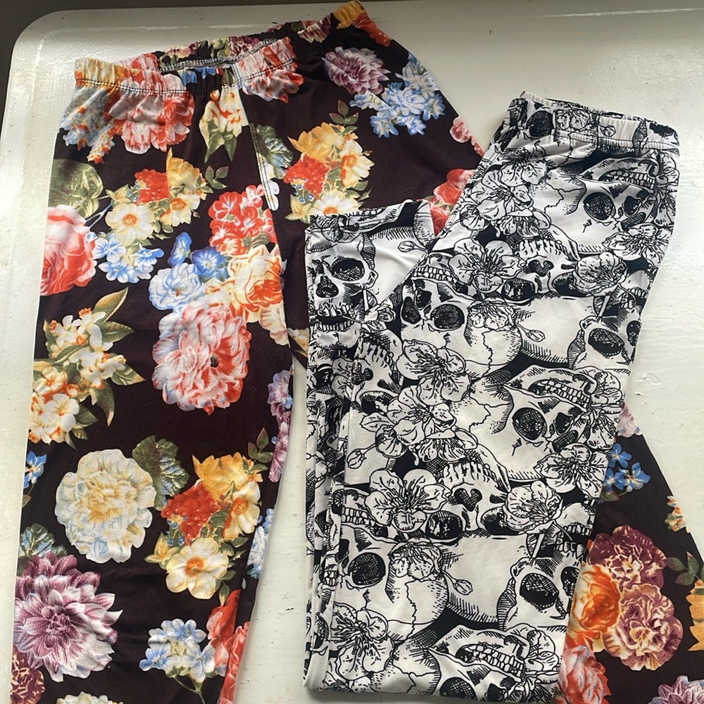 Two pairs Agnes & Dora S/M adult leggings fit US sizes 4-12. Near new condition